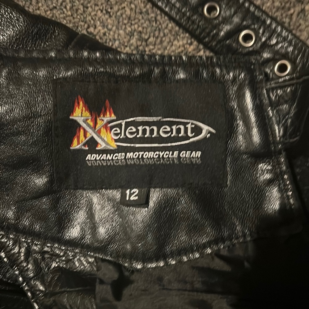 Women’s size 12 motorcycle chaps. Brand is Xelement advanced motorcycle gear.